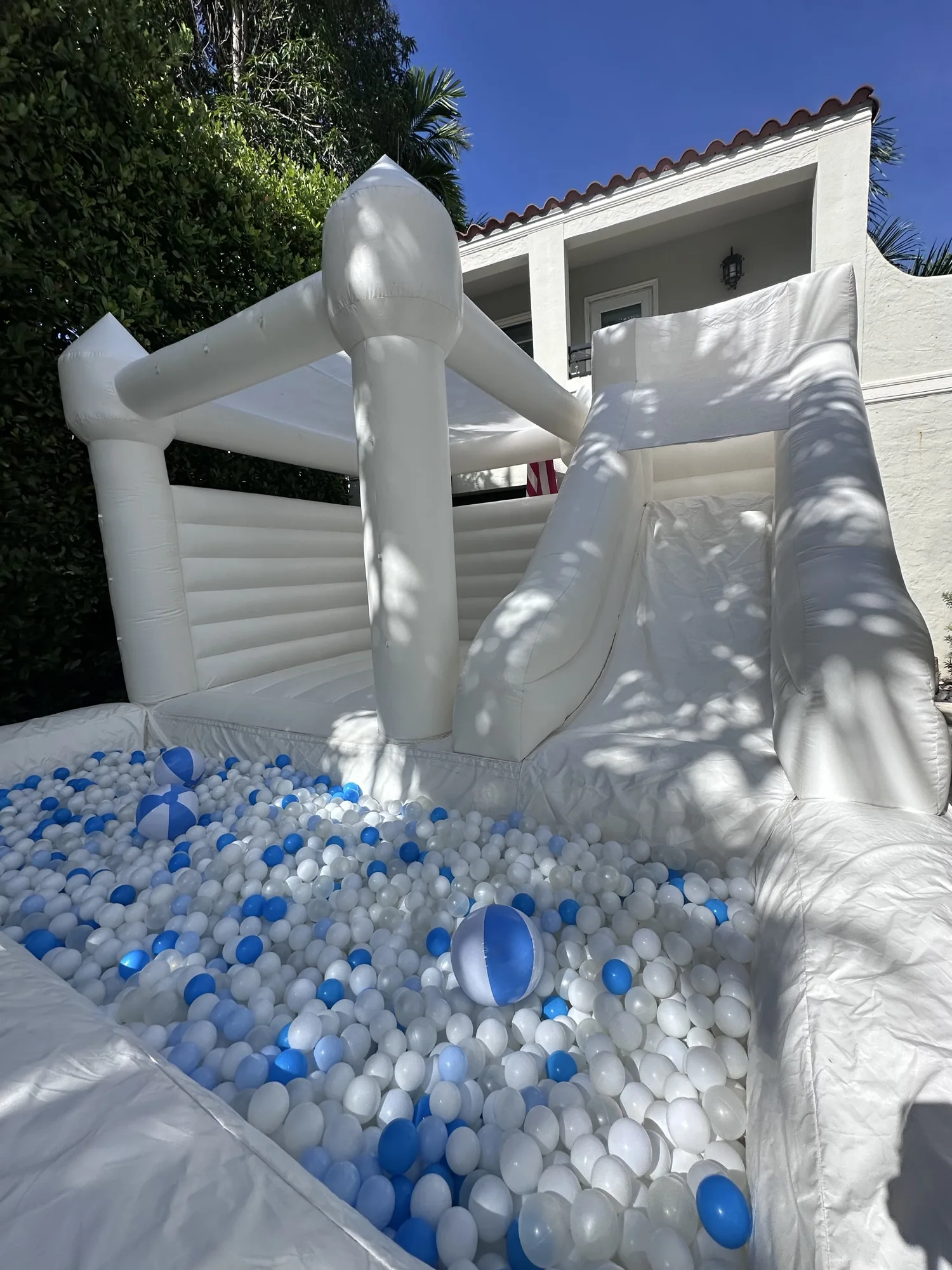 3-in-1 Empire Castle water inflatable rental set up for a kids party in Miami, 16 × 16 ft white — 2 of 6