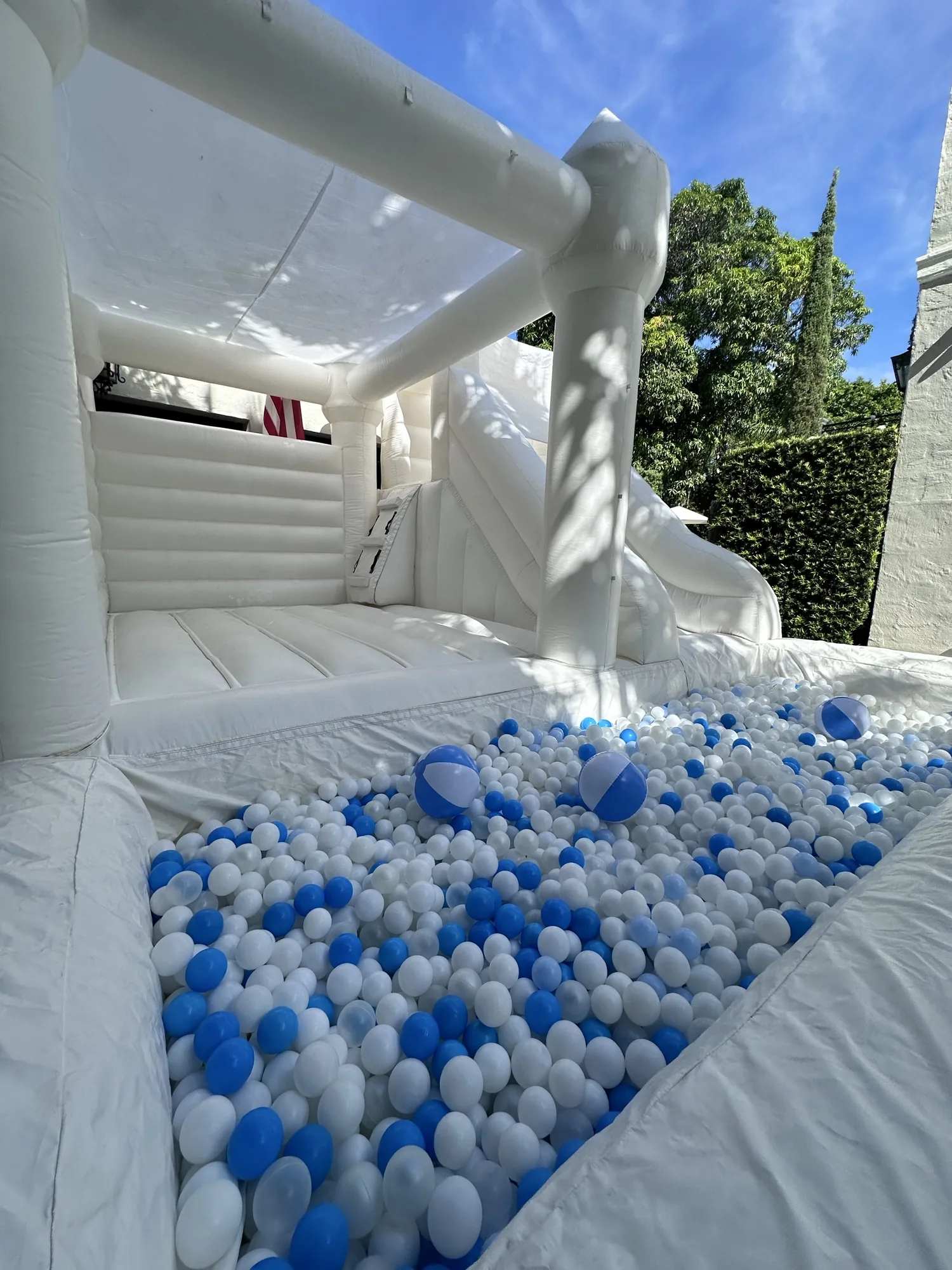 3-in-1 Empire Castle water inflatable rental set up for a kids party in Miami, 16 × 16 ft white — 3 of 6