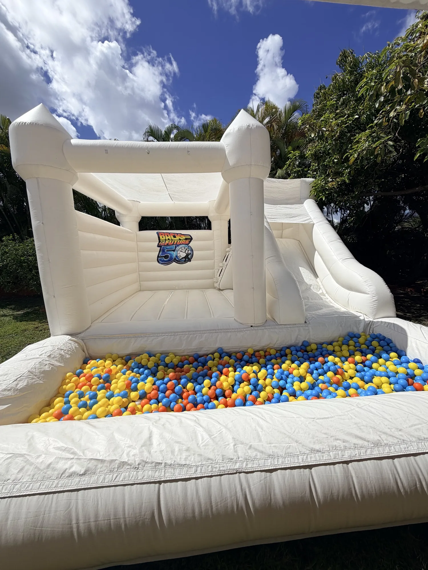 3-in-1 Empire Castle water inflatable rental set up for a kids party in Miami, 16 × 16 ft white — 4 of 6