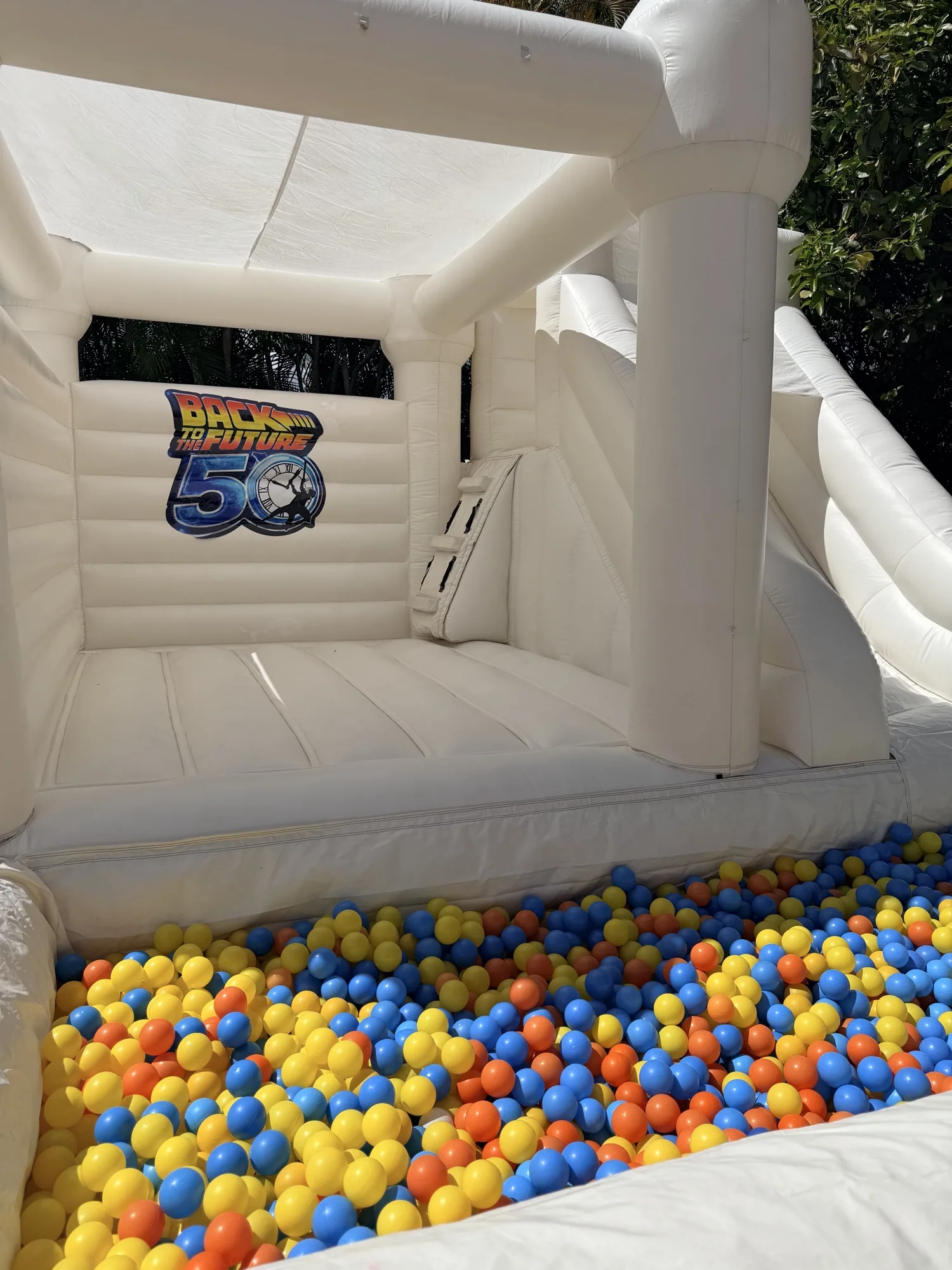 3-in-1 Empire Castle water inflatable rental set up for a kids party in Miami, 16 × 16 ft white — 5 of 6